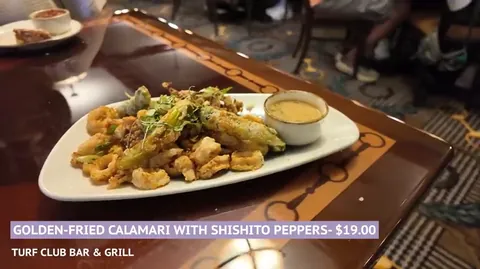 Fried calamari with shishito peppers at Turf Club